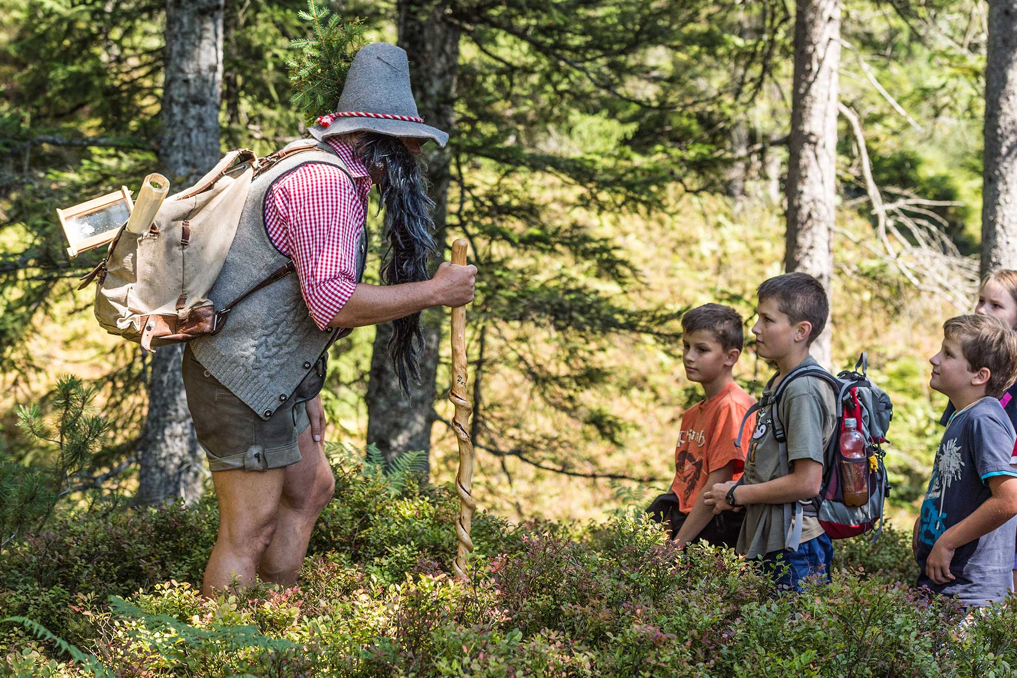 Photo: Children hiking at the vacation apartment Söll Wilder Kaiser Tirol Austria on a last minute vacation with dog