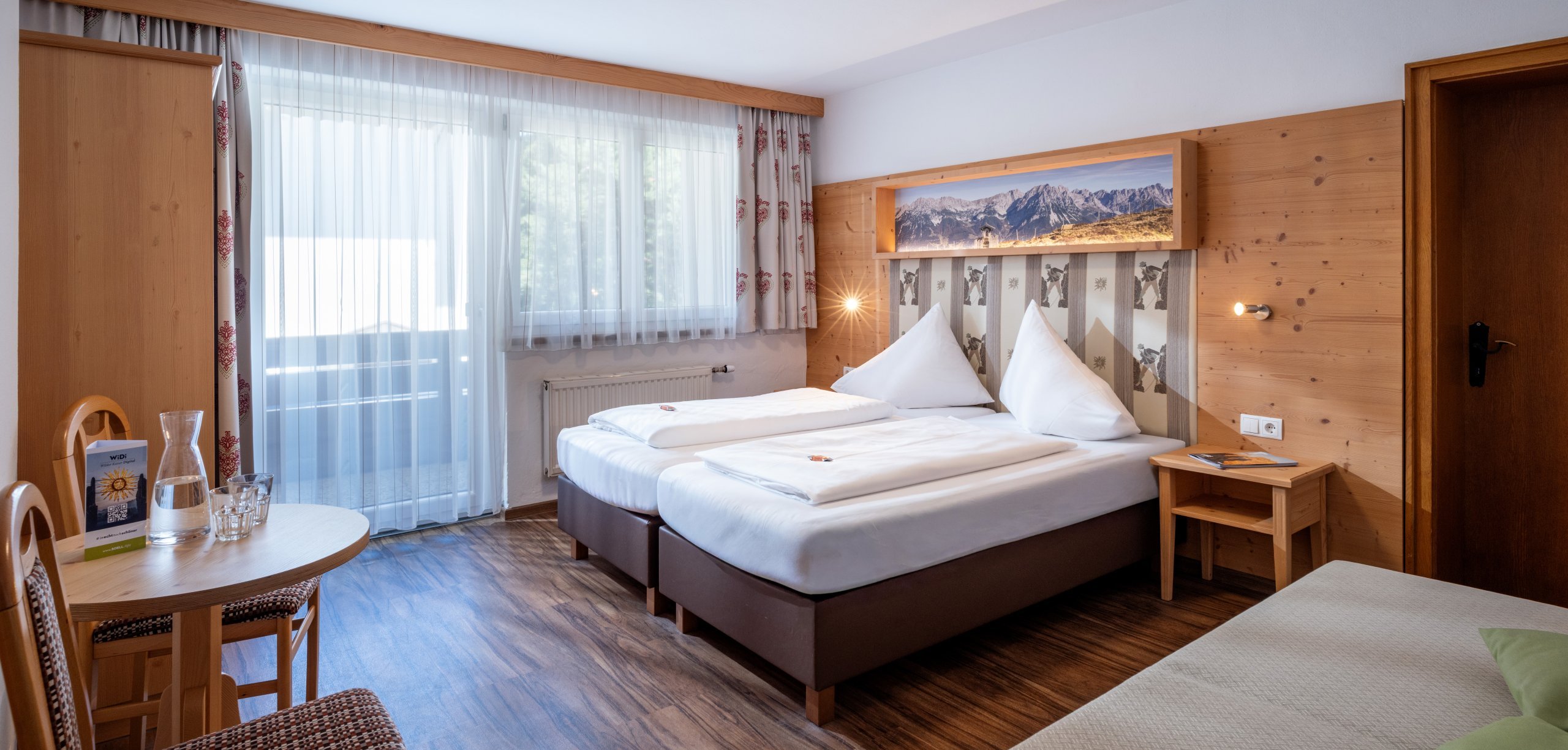 Dreibettzimmer im Hostel Dorfglück