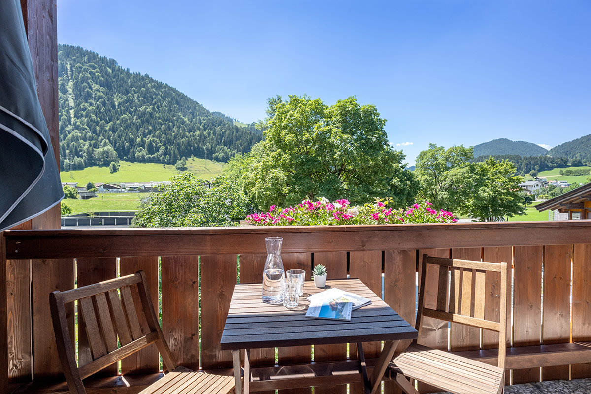 Balcony with seating in the hostel in Söll in Tyrol