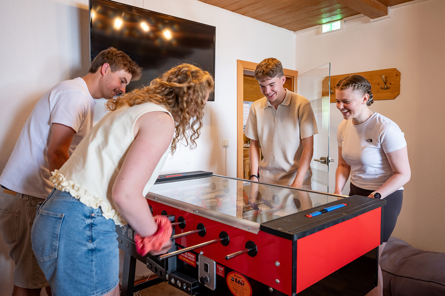 Playing at the foosball table in Söll in Tyrol